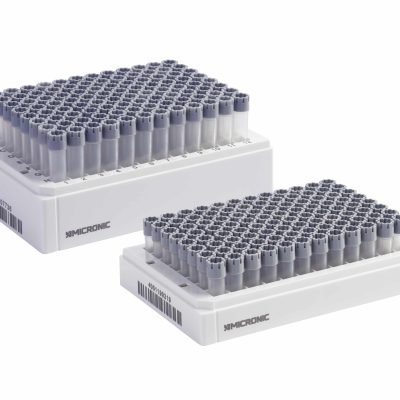Two Micronic racks of externally threaded tubes precapped with grey screw caps