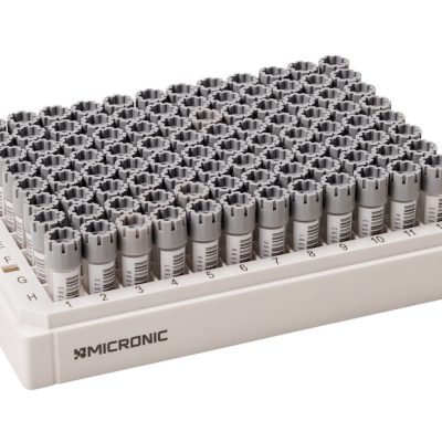 An uncovered rack with 0.75ml externally threaded hybrid tubes with human readable codes and 1D side barcodes precapped with grey screw caps