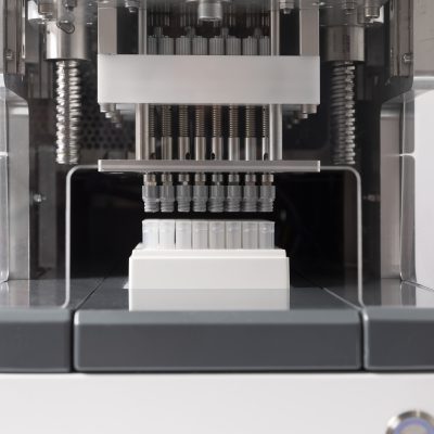 A close-up view of the CS700 decapping a rack of 96 tubes precapped with grey screw caps