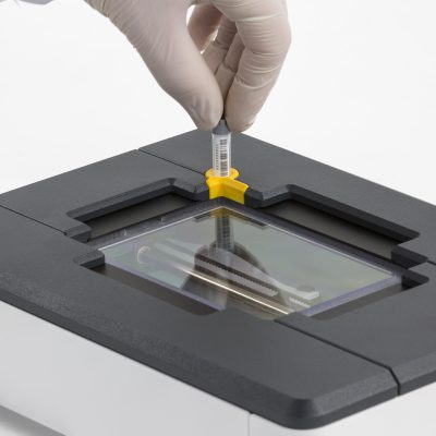 A single tube being scanned by the DR500 rack reader by Micronic