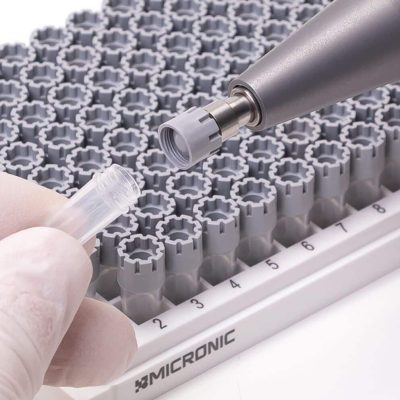 The Microninc CS100 screw cap recapper being used to (de)cap a screw cap tube