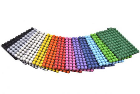 The range of capclusters by Micronic: black, grey, white, natural, yellow, orange, red, pink, purple, blue, light blue, light green, and green