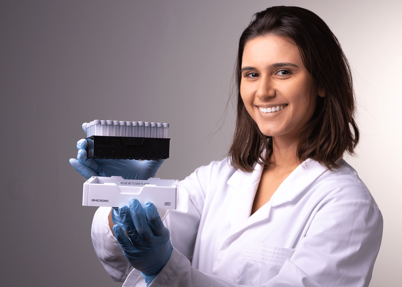 Scientist holding a Micronic sample storage rack